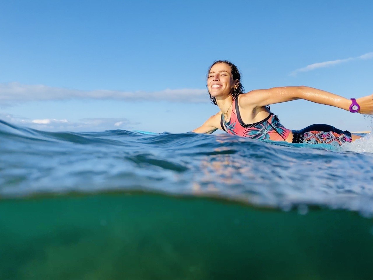 Woman paddling on surfboard in Morocco – Surf Treasure Morocco