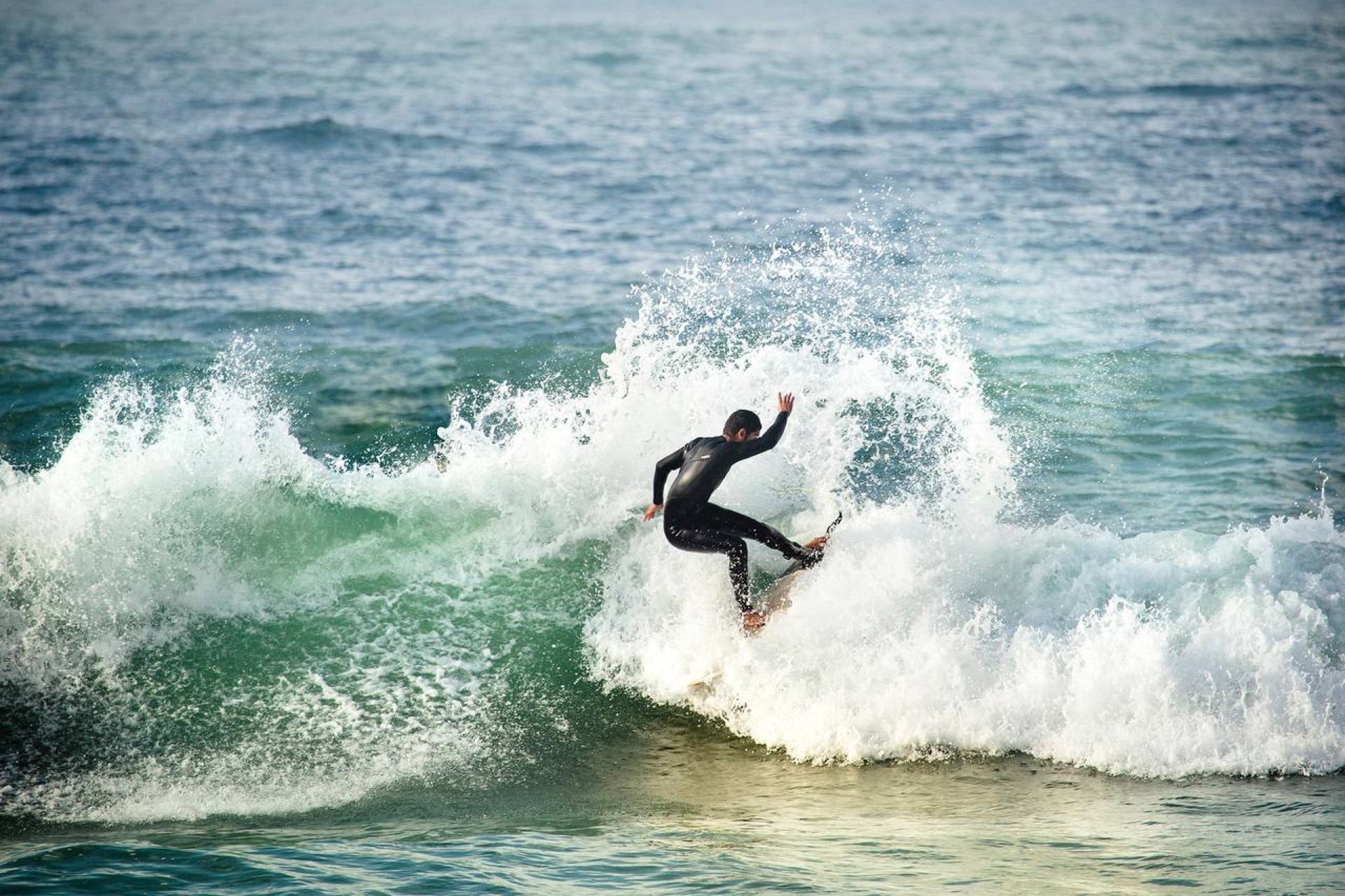 Hamza coaching surf group on the beach
