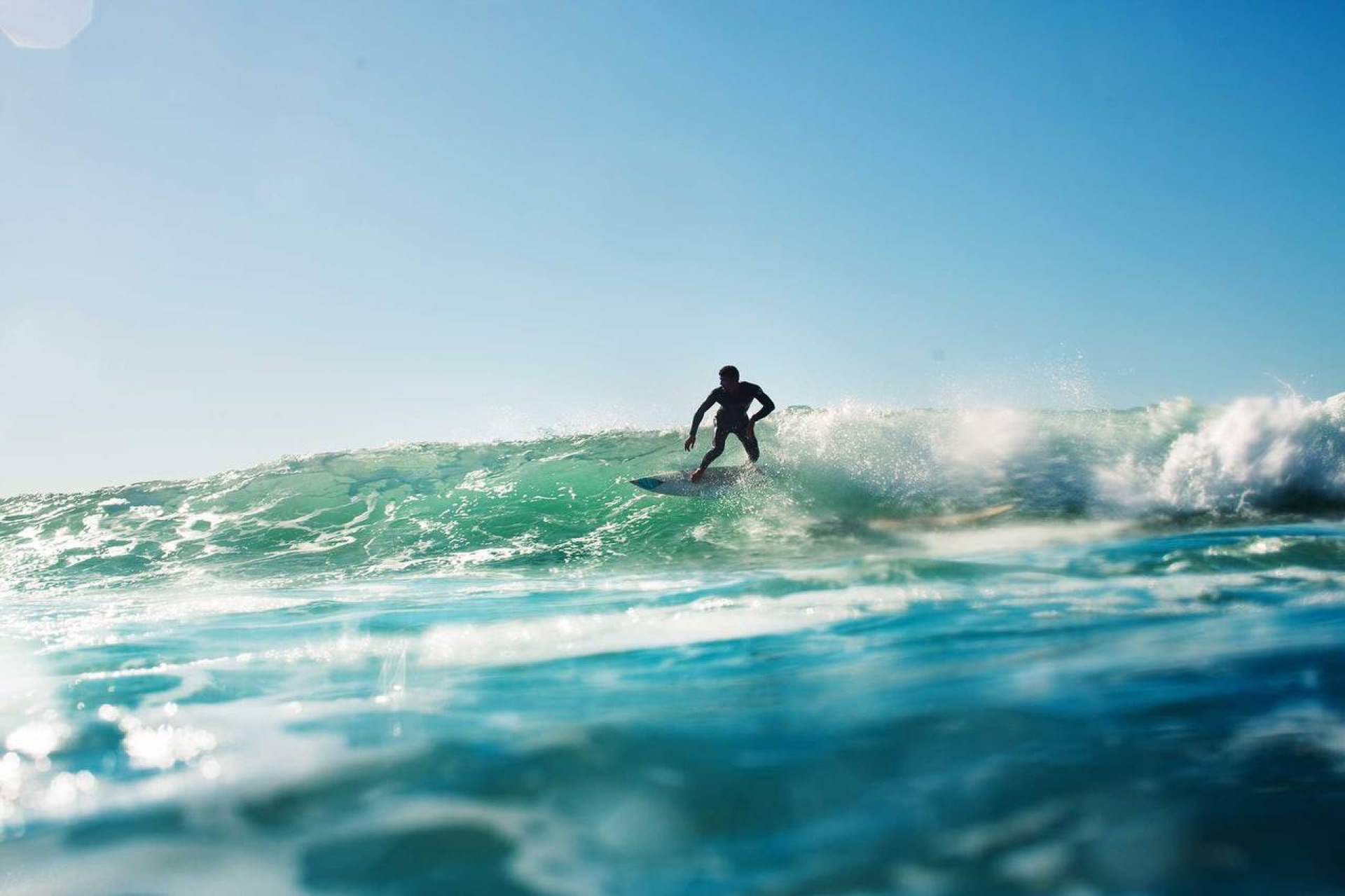 Surfer riding a wave at Tamri, Morocco